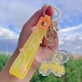 Yellow unicorn milk tea key ring with liquid glitter and sakura flower pendant - Yellow-Cherry Blossom Unicorn