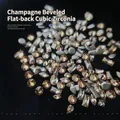 Macro detail of 50pcs champagne nail art rhinestones in various mixed geometric shapes - Champagne Mixed (XY-998)