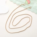 Detail view of a flexible gold snake chain with lobster clasps for crossbody phone cases - 3.2mm Gold Snake Chain