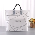 White PE plastic shopping bag with black geometric lines and soft handles for boutique - 33x25cm+Bottom 3cm / White