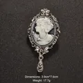 Zilveren vintage camee broche met zwart profiel en druppelhanger, 3,9cm x 7,6cm - 3.9x7.6cm / Grijs (XD7356)