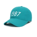 Classic cotton baseball cap in teal blue featuring 1987 white numeric embroidery - Adjustable / Lake Blue