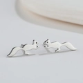 Minimalist silver squirrel stud earrings in stainless steel on a neutral background - 511 Steel (Squirrel)