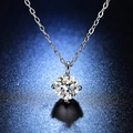 Macro shot of 1-carat moissanite necklace featuring a 4-prong setting on a deep blue background - Q002 Four-Prong 1ct