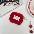 Macro detail of red corduroy small storage bag with silver zipper and woven logo tag - Corduroy Bright Red Card Case
