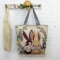 Beige canvas tote bag with cute cartoon rabbit floral pattern and striped handle - Heart Rabbits