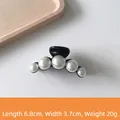 Medium black hair claw clip featuring elegant white faux pearls on a glossy resin base - 23# Five Pearls Medium Black - 7cm