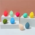 Macro shot of colorful beauty sponges in teardrop shapes on white podium displays - Teardrop Cut (Bulk)