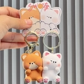 Cute white and orange matte resin cat keychains on a Sweety paper display card - Cat