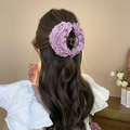 Purple fabric flower hair claw clip shown from back view on long wavy brown hair - Purple Large Flower (Large Claw)
