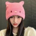 Close-up of pink knitted hat with cute cat ears and minimal animal embroidery detail - Pink Bear Ear Style