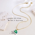 Detail view of gold chain necklace with green heart pendant and size specifications - Necklace-Heart