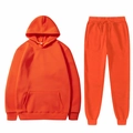 Vibrant bright orange hoodie and drawstring pants tracksuit set in flat lay presentation - Orange