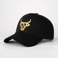 Detailed close-up of golden bull head embroidery on a black structured baseball cap - Adjustable / Black