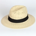 Detail of classic cream straw sun hat featuring a wide brim and black ribbon decoration - Adjustable / Beige