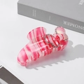 Pink and white striped acetate hair claw clip with rhinestones in a bow shape - Red
