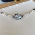 Elegant silver oval watch with double-row pearl bracelet and Roman numeral dial - White Dial Silver Case