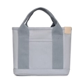 Close-up of gray canvas lunch bag featuring two-tone design and side decorative label - Light Gray