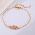 Close-up of golden paperclip bracelet with micro-paved cubic zirconia and lobster clasp - KC Gold Pavé Paper Clip Bracelet (5957)