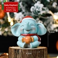 Mini resin Christmas elephant figurine with Santa hat and orange candy, 4.2x4x5.5cm - Elephant SD10