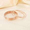 Stackable rose gold 3mm stainless steel round wire bangles in a minimalist multi-layer design - 7-Piece Set Rose Gold