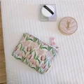 Detail of floral makeup bag with tulip print, simple wish label and pink zip puller - Pink Tulip