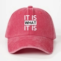 Detail view of the washed red cotton baseball cap with IT IS WHAT IT IS printed slogan - One Size(Adjustable) / Washed Watermelon Red