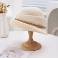 Elegant French style beige woven bucket hat with brown leather belt buckle detail - Off White