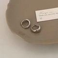 Macro view of chunky silver hoop earrings on a ceramic dish with high-polished mirror finish - Silver 17mm (Medium)