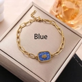 Goldenes Gliederkettenarmband mit blauem Marmoranhänger und Hamsa-Hand-Symbol - Hamsa Hand-Blauer Stein