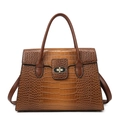 Brown crocodile pattern leather handbag with metallic twist lock on white background - Brown
