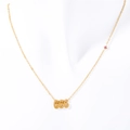Gold stainless steel 666 angel number necklace featuring a small pink gemstone - 666