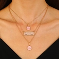 Three-layer gold necklace with pink enamel MOM heart pendant on a female model - Gold Enamel Mom (N-302)