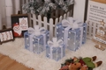 Three transparent blue Christmas gift boxes with white bows and star patterns decor - Blue Mesh White Star Christmas Gift Box