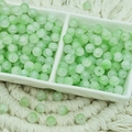 Macro detail of 6mm light green ice-cracked glass beads in a ceramic organizer tray - Jade Texture Light Green (6mm)