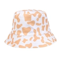 Reversible bucket hat with light orange cow print pattern and cotton texture style - One Size / Yellow