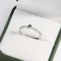 Detailed view of silver adjustable ring with crystal letter P in a green velvet box - Platinum P