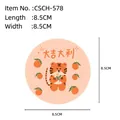 Round wood pulp sponge with cute cartoon tiger and orange print in 8.5cm diameter - Lucky Tiger