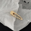 Minimalist golden metal duckbill hair clip with a polished hollow geometric design - Gold Geometric Frame Style