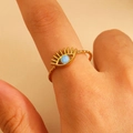 Close-up of golden evil eye ring with hammered metal texture and blue enamel inlay - 18k Gold Plated (WG-1302)