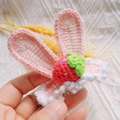 Handmade crochet hair clip featuring pink rabbit ears, white lace, and a red strawberry - Pink White Gauze Strawberry Rabbit