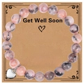 Dettaglio del bracciale in pietre naturali con ciondolo a cuore su carta regalo artigianale - Bracciale in Pietra Zebra Rosa