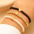 Set di tre braccialetti di perline elasticizzati con ciondolo a cuore dorato per tutti - Set da 3 Pezzi Cuore (10915)