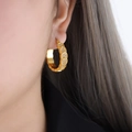 Chic geometric gold-plated hoop earrings with sparkling cubic zirconia on model - F900 White Zirconia Gold Earrings