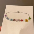 Macro view of French style bracelet with colorful multi-cut gemstones and silver chain - 21# Bracelet - Multicolor - Pink Heart