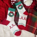 Christmas coral fleece socks with green wreaths and red heels in festive holiday gift packaging - One Size / White with Wreath