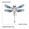 Silver dragonfly brooch featuring blue and white enamel wings with rhinestone accents - Silver Gray Blue