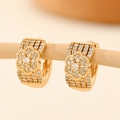 Detailed close-up of champagne gold hoop earrings with zircon floral design - EH214 Retro Floral Hollow