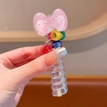Pink polka dot bow hair clip with colorful spiral resin handle for stylish ponytails - Pink Bow Spiral Hair Tie