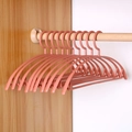 Non-slip wide shoulder coat hangers in dusty rose color for home wardrobe storage - Semicircle Pink